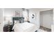Serene bedroom with plush bedding, elegant decor, and ample closet space at 7656 Gemstone St, Groveland, FL 34736