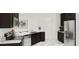Modern kitchen featuring stainless steel appliances, dark cabinetry, and bright countertops at 7656 Gemstone St, Groveland, FL 34736