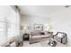 Comfortable living room with large windows providing natural light at 7656 Gemstone St, Groveland, FL 34736