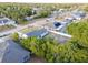 A residential home with a fenced yard, lush trees, and a long driveway at 2769 Corrigan Dr, Deltona, FL 32738