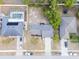 A residential neighborhood with a home, manicured landscaping, and a pool in a fenced yard at 2769 Corrigan Dr, Deltona, FL 32738