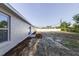 Home's backyard featuring a white fence and sliding glass door at 2769 Corrigan Dr, Deltona, FL 32738