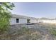 Home's backyard features a privacy fence and sliding glass door at 2769 Corrigan Dr, Deltona, FL 32738
