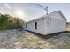 Home's backyard features a sliding glass door and fresh landscaping at 2769 Corrigan Dr, Deltona, FL 32738