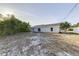 The backyard is spacious with mature trees and sliding glass door at 2769 Corrigan Dr, Deltona, FL 32738