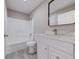 Bathroom with white cabinets, new fixtures, mirror, and shower-tub combination at 2769 Corrigan Dr, Deltona, FL 32738
