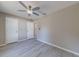 Spacious bedroom with neutral color scheme, ceiling fan, and multiple doors at 2769 Corrigan Dr, Deltona, FL 32738