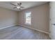A well-lit bedroom featuring neutral walls, ceiling fan, and a window with natural light at 2769 Corrigan Dr, Deltona, FL 32738