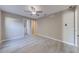 Bright bedroom with neutral color scheme, ceiling fan, and an ensuite bathroom at 2769 Corrigan Dr, Deltona, FL 32738