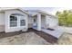 Newly renovated home showcasing fresh landscaping, a modern walkway, and a two-car garage at 2769 Corrigan Dr, Deltona, FL 32738