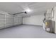 Clean garage interior with updated door and mechanical equipment at 2769 Corrigan Dr, Deltona, FL 32738