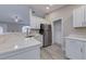 Bright kitchen with white cabinets, stainless steel refrigerator, and stunning quartz countertops at 2769 Corrigan Dr, Deltona, FL 32738