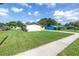 The home's exterior view showcases a vast lawn and an outside view of neighboring homes at 4821 S Gachet Blvd, Lakeland, FL 33813