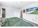 Comfortable bedroom features a large television mounted on the wall for entertainment at 4821 S Gachet Blvd, Lakeland, FL 33813