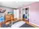 Comfortable bedroom with hardwood floors has a spacious closet and a television for entertainment at 4821 S Gachet Blvd, Lakeland, FL 33813