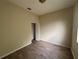 This bedroom features wood floors, neutral color, and a closet at 2163 Wintermere Pointe Dr, Winter Garden, FL 34787