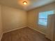 This bedroom features wood floors, a window, a neutral color, and a closet at 2163 Wintermere Pointe Dr, Winter Garden, FL 34787