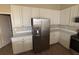 Bright, modern kitchen featuring stainless steel appliances and white cabinetry at 2163 Wintermere Pointe Dr, Winter Garden, FL 34787