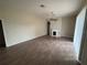 Inviting living room with a decorative fireplace and ample natural light at 2163 Wintermere Pointe Dr, Winter Garden, FL 34787