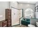 Bathroom with shower and soaking tub with arched window allowing natural light at 25302 Lido Ave, Sorrento, FL 32776