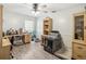 Neutral bedroom with a ceiling fan and light wood floors perfect for a home office at 25302 Lido Ave, Sorrento, FL 32776