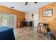 Spacious bedroom with wood paneled wall, double doors, and tiled flooring at 25302 Lido Ave, Sorrento, FL 32776