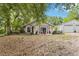 Charming single-story home featuring a welcoming front porch, beautifully landscaped yard and detached garage at 25302 Lido Ave, Sorrento, FL 32776