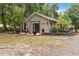 Charming home exterior with a cozy front porch area and lush landscaping, creating an inviting entrance at 25302 Lido Ave, Sorrento, FL 32776