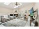 Sunlit living room with fireplace, vaulted ceilings, skylights, and a neutral color scheme at 25302 Lido Ave, Sorrento, FL 32776