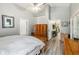 Bright main bedroom with vaulted ceilings, wood floors, and ensuite bathroom access at 25302 Lido Ave, Sorrento, FL 32776