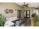 Inviting covered patio with comfortable seating and tiled floor, perfect for outdoor relaxation and entertaining at 25302 Lido Ave, Sorrento, FL 32776