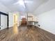 Large upstairs bedroom features expansive floors, a ceiling fan and view of bathroom at 2900 Cr 415, Lake Panasoffkee, FL 33538