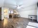 Large upstairs bedroom features expansive floors, a ceiling fan and view of bathroom at 2900 Cr 415, Lake Panasoffkee, FL 33538