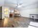 Large upstairs bedroom features expansive floors, a ceiling fan and view of bathroom at 2900 Cr 415, Lake Panasoffkee, FL 33538