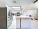 Bright kitchen featuring ample counter space, white cabinetry, and stainless steel appliances at 2900 Cr 415, Lake Panasoffkee, FL 33538