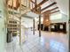 Spacious open floor plan with spiral staircase, fireplace, and beamed ceilings at 2900 Cr 415, Lake Panasoffkee, FL 33538