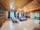 Spacious living room with hardwood floors, built-in shelving, and comfortable seating at 2900 Cr 415, Lake Panasoffkee, FL 33538