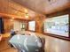 Bright living room with wood accents and an open floor plan to the kitchen and outdoor spaces at 2900 Cr 415, Lake Panasoffkee, FL 33538