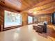 Inviting living room featuring wood accents, an open layout, and views of the kitchen area at 2900 Cr 415, Lake Panasoffkee, FL 33538