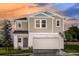 Charming two-story home featuring a two-car garage and attractive landscaping at 1748 Frogmore Ave, Haines City, FL 33844