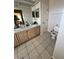 A bathroom is equipped with dual sinks and tile flooring at 2528 Deerbrook Dr, Lakeland, FL 33811