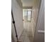 Spacious bathroom featuring neutral tiles, a glass-enclosed shower and a separate soaking tub at 2528 Deerbrook Dr, Lakeland, FL 33811
