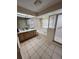 Bright bathroom with double vanity, soaking tub, walk-in shower with glass door, and tile flooring at 2528 Deerbrook Dr, Lakeland, FL 33811