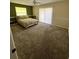 Bedroom with light-filled window and carpet floor at 2528 Deerbrook Dr, Lakeland, FL 33811