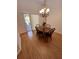 Dining area features wood floors and a view of the screened-in lanai at 2528 Deerbrook Dr, Lakeland, FL 33811