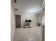 Dining room with a decorative light fixture, wainscoting, and tile flooring at 2528 Deerbrook Dr, Lakeland, FL 33811