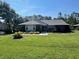 Well-maintained single-story home featuring a brick facade and a neatly manicured lawn at 2528 Deerbrook Dr, Lakeland, FL 33811