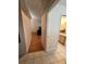 Hallway with tile and wood floors leading to the bathroom and living area at 2528 Deerbrook Dr, Lakeland, FL 33811