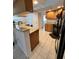 Well-lit kitchen with granite countertops, wooden cabinets, and modern black appliances at 2528 Deerbrook Dr, Lakeland, FL 33811