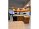 Kitchen view showcasing granite countertops, wooden cabinets, and stainless steel appliances at 2528 Deerbrook Dr, Lakeland, FL 33811